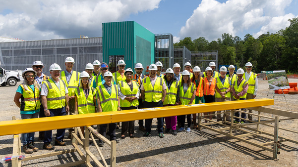 DOE Office of Isotope R&D and Production and ORNL staff gather for a group photo at the Stable Isotope Production and Research Center (SIPRC) construction site during a tour.